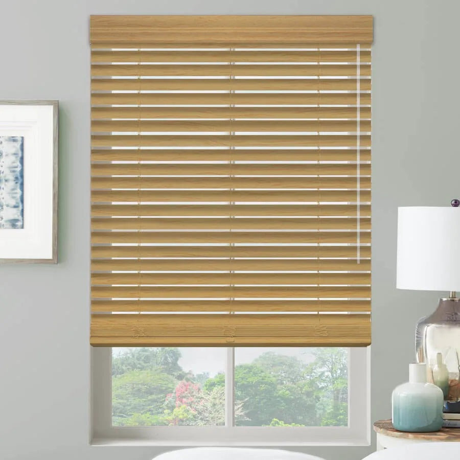 Two inch faux wood blinds in Golden Oak with a decorative valance, slats tilted partly open