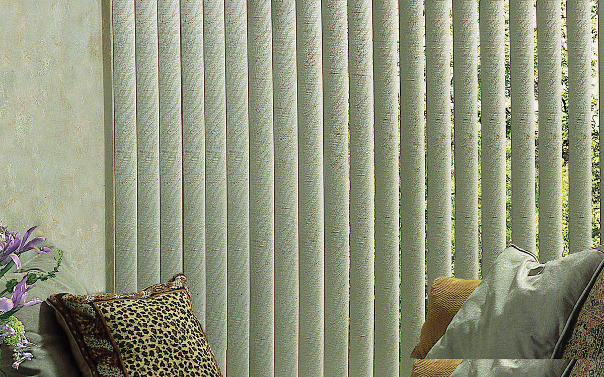 Close view of textured vertical blind vanes rotated part way open